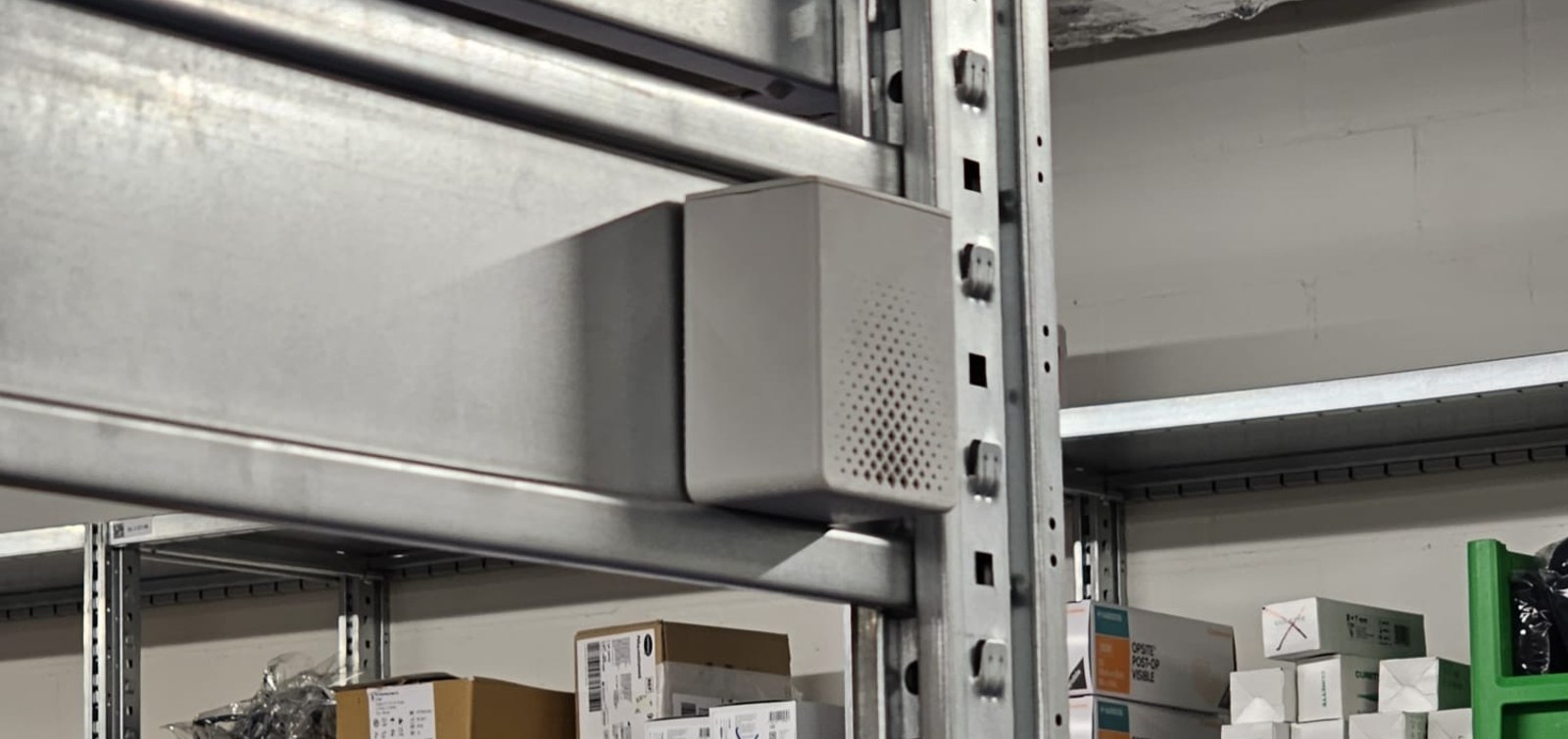 The sensing node mounted on shelving in a sterile supply store
