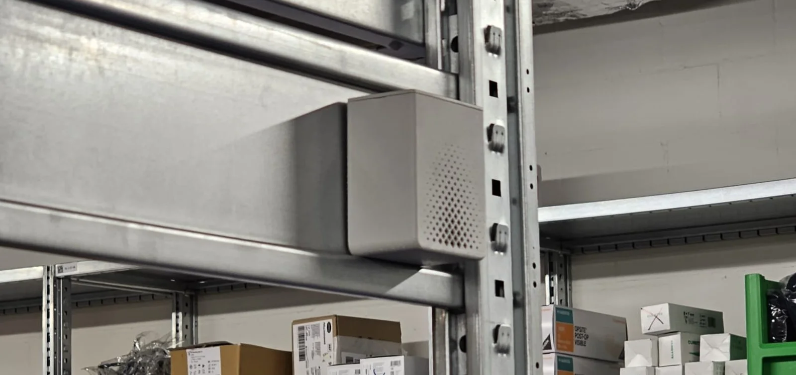 The sensing node mounted on shelving in a sterile supply store